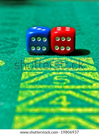 two dice with number six in game table - focus on the dice