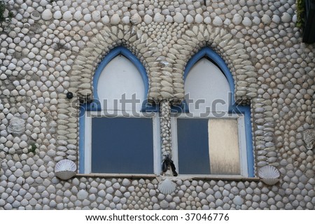 Decorative Window in Sea Shell Covered House