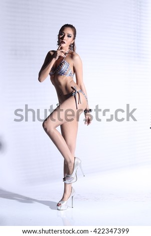 Asian Thai Female Woman Model Tan Skin in Grey Dot Bikini Sport Swim wear Suit Wet Hair, Studio Lighting Shadow on White Background, Sexy Pose Stand Full body concept
