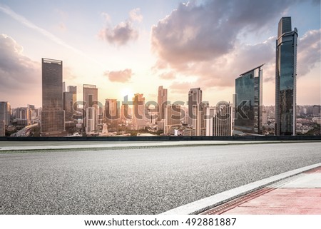 city road with cityscape and skyline of shanghai CBD
