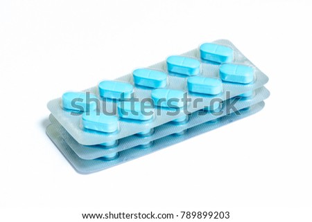 Three new packs of 10 blue oblong pills isolated on a white background