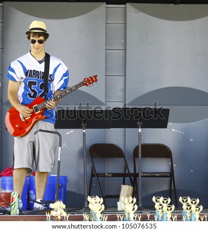 HAMPTON, VA-JUNE 9:Guitar player at the 3rd annual HCS car show at the Hampton Christian School in Hampton Virginia, 2012 in Hampton Virginia on June 9, 2012.