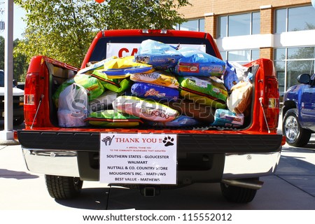 GLOUCESTER, VA- OCTOBER 13:Pickup full of dog food at the Ken Houtz Chevrolet Buick, Camaro VS Corvette Humane Society car show and food drive in Gloucester, Virginia on October 13, 2012