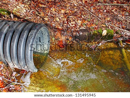 A waste water drainage pipe re-routing the water flow and polluting the environment at the same time