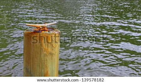 A round wooden Pile mooring for you to tie your boat off on in the water