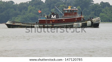 YORK RIVER, VIRGINIA - JULY 22: The Patricia Moran Tug Boat awaiting the USS Cape St. George (CG-71) a Ticonderoga-class cruiser on route to the Naval weapons station , Virginia on July 22, 2013.