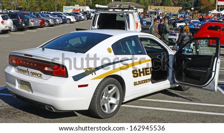 GLOUCESTER, VA- NOVEMBER 9: A new Gloucester County Sheriffs Dodge Dart in the Shop with a Cop Car Show in Gloucester, Virginia on November 9, 2013