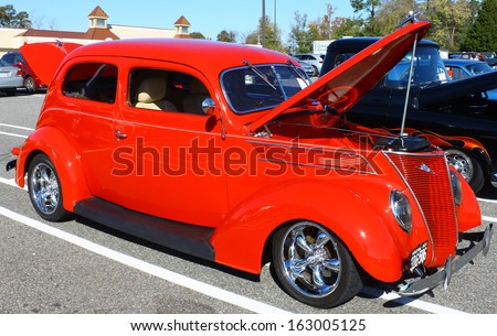 GLOUCESTER, VA- NOVEMBER 9: A red 1937 Ford in the Shop with a Cop Car Show in Gloucester, Virginia on November 9, 2013