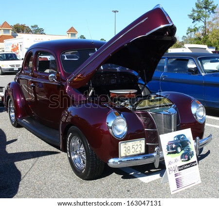 GLOUCESTER, VA- NOVEMBER 9: A 1940 Ford Deluxe in the Shop with a Cop Car Show in Gloucester, Virginia on November 9, 2013
