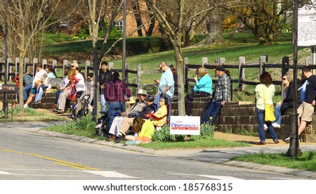 GLOUCESTER, VA - April 5, 2014: Spectators lined up, saving their spot awaiting the 28th Annual Daffodil parade in Gloucester Virginia, The Daffodil fest and Parade is a regular event held each spring