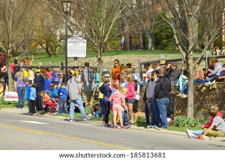 GLOUCESTER, VA - April 5, 2014: Spectators lined up saving their spot awaiting the 28th Annual Daffodil parade in Gloucester Virginia, The Daffodil fest and Parade is a regular event held each spring