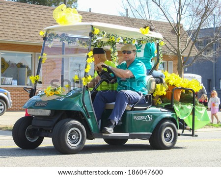 GLOUCESTER, VA - April 5, 2014: Riverside hospital and Sanders Retirement Village Staff walking in the parade, The Daffodil fest and Parade is a regular event held each spring