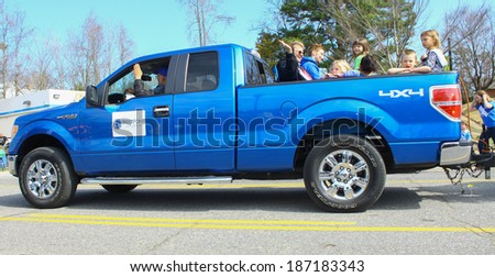 GLOUCESTER, VA - April 5, 2014: 28th annual Daffodil parade, A Ford truck with BridgePoint Church members in the parade, The Daffodil fest and Parade is a regular event held each spring