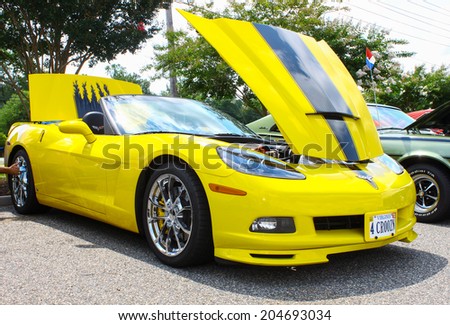 GLOUCESTER, VIRGINIA - JULY 12, 2014: A Canary Yellow Chevrolet Corvette in the Blast from the PAST CAR SHOW,The Blast From the Past car show is held once each year in July in Gloucester Virginia.