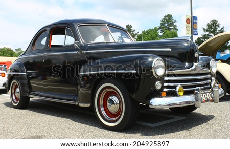 GLOUCESTER, VIRGINIA - JULY 12, 2014: A Black 1948 Ford coupe in the Blast from the PAST CAR SHOW,The Blast From the Past car show is held once each year in July in Gloucester Virginia.