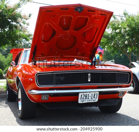 GLOUCESTER, VIRGINIA - JULY 12, 2014: A Red 1967 Chevrolet Camaro RS in the Blast from the PAST CAR SHOW,The Blast From the Past car show is held once each year in July in Gloucester Virginia.