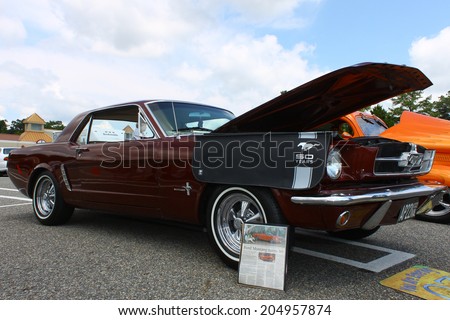 GLOUCESTER, VIRGINIA - JULY 12, 2014:A Burgundy 1965 Ford Mustang in the Blast from the PAST CAR SHOW,The Blast From the Past car show is held once each year in July in Gloucester Virginia.