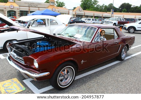 GLOUCESTER, VIRGINIA - JULY 12, 2014:A Burgundy 1965 Ford Mustang in the Blast from the PAST CAR SHOW,The Blast From the Past car show is held once each year in July in Gloucester Virginia.