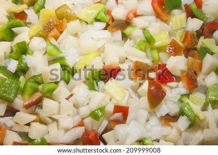 A fresh garden vegetable stir fry comprised of fresh garden vegetables, onions, banana peppers, red peppers, green peppers and potatoes