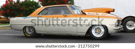 GLOUCESTER, VIRGINIA - AUGUST 23, 2014:An orange blown and tubbed 1966 Chevy II SS in the DRIVE-IN FOR DIABETES CAR SHOW Sponsored by Tractor Supply in August in Gloucester Virginia.