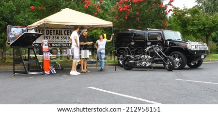 GLOUCESTER, VIRGINIA - AUGUST 23, 2014:An auto detail center tent in the DRIVE-IN FOR DIABETES CAR SHOW Sponsored by Tractor Supply in August in Gloucester Virginia.