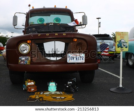 GLOUCESTER, VIRGINIA - AUGUST 23, 2014:A Ford Tow Mater tow truck like the one from Cars the movie in the DRIVE-IN FOR DIABETES CAR SHOW Sponsored by Tractor Supply in August in Gloucester Virginia.