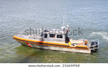 GLOUCESTER, VA - SEPTEMBER 6, 2014: A US Coast Guard marine patrol boat cruising and paroling the York river and Chesapeake bay in Yorktown Virginia on a summer day
