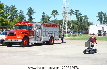 MIDDLESEX, VA - SEPTEMBER 27, 2014: A Hartfield volunteer fire department, V.F.D. truck #56 at the wings, wheels and keels Hummel Air Field airport Aviation air field and runway in Middlesex VA