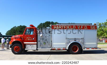 MIDDLESEX, VA - SEPTEMBER 27, 2014: A Hartfield volunteer fire department, V.F.D. truck #56 at the wings, wheels and keels Hummel Air Field airport Aviation air field and runway in Middlesex VA
