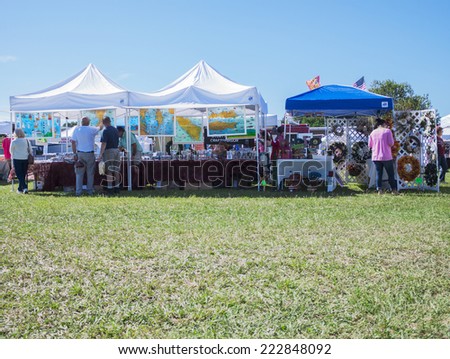 MIDDLESEX, VA - SEPTEMBER 27, 2014: An event vendor set up for business at hummel field airport runway in the wings wheels and keels annual show at the Hummel airfield airstrip in Middlesex VA