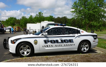 WILLIAMSBURG, VA - May 9, 2015: A James City County police car on display\
at The 6th Annual Project Lifesaver Car Show in Williamsburg Virginia on a summer day.