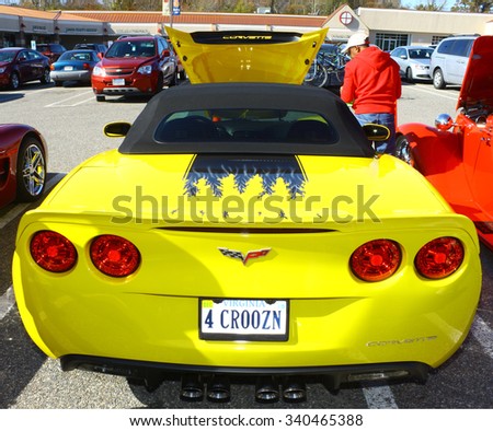 GLOUCESTER, VIRGINIA - NOVEMBER 14, 2015: A yellow Chevy Corvette in the annual Shop With a Cop Car Show held once each year to help benefit needy children of Gloucester for Christmas.