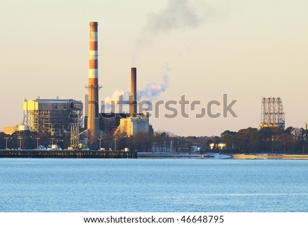 A power plant on the york river spewing pollution into the atmosphere