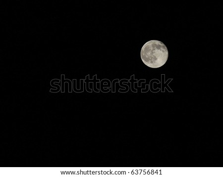 A full moon fall night against a black sky with room for your text.