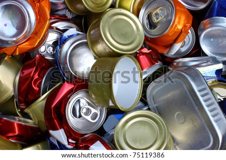 A bunch of crushed aluminum cans all together for recycling to help be green for the Earth and to be environmentally friendly