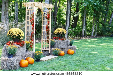 stock photo A handmade wooden Arch decorated for a wedding in the setting 