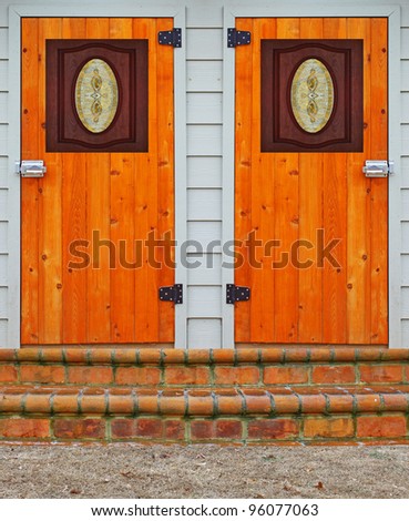 A couple of steps leading to two wooden doors for you to choose from with room for your text