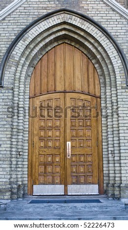Grand antique entry doors of an ornate church