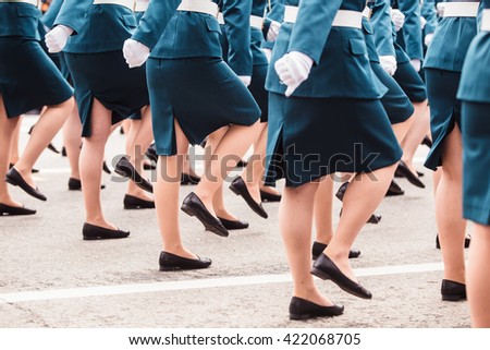 The women soldiers in military uniform at a military parade