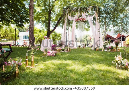 Wedding decoration (arch on the lawn in the park)