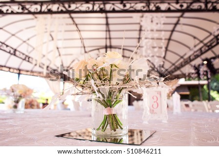 decoration of flowers on the table for the guests invited to the wedding