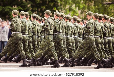 military men marching to victory parade