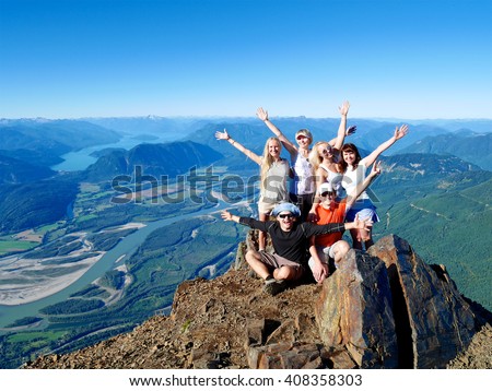 Successful Group of Happy Friends on Mountain Top, Cheering. \
Mount Cheam Summit,  British Columbia, Canada.
