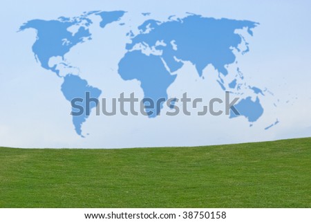 Outline of world map in blue sky above green grass
