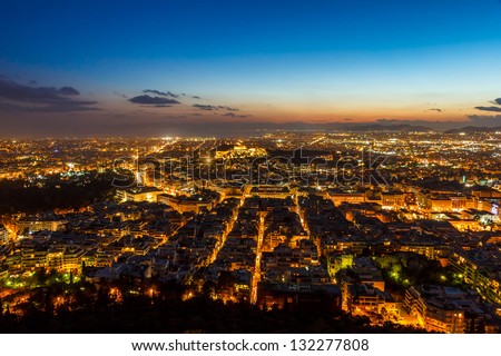 Athens skyline aerial view in the afternoon with the lights over blue hour, Syntagma, Greek Parliament and Parthenon are visible