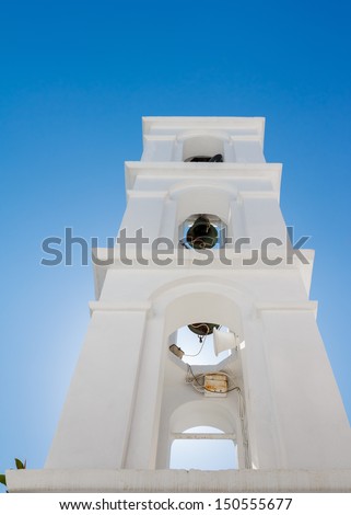 Traditional white bell tower at Tinos Island in Cyclades, Greece