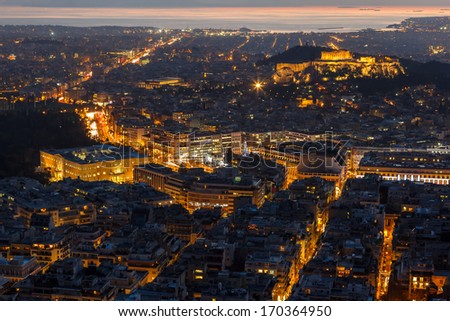 Athens skyline aerial view in the afternoon with the lights over blue hour, the Parthenon is visible