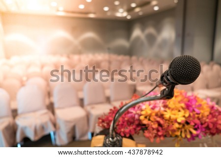 Close up of microphone in concert hall or seminar room