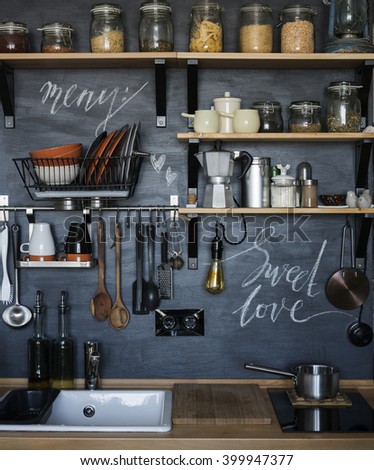 The design of the modern home kitchen in the loft-style and rustic. \black wall with shelves , trays , jars , mugs , sink .