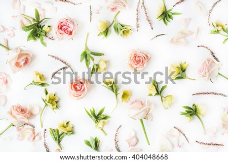 Wallpaper, texture. Pink roses and yellow flowers on white background. Flat lay, top view
